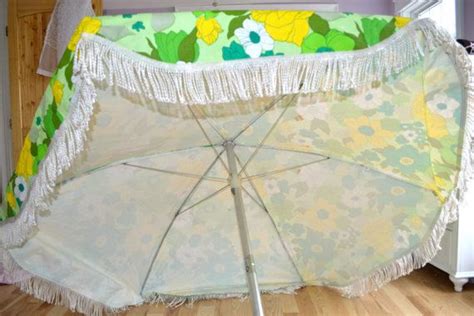 Customize your umbrella using stencils and applying pray paint that is a contrasting color. Vintage Patio Beach Umbrella Floral Citiris Colors White ...