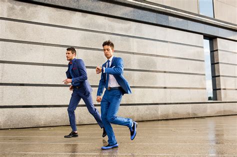 Two Businessmen In A Hurry On The Street Stock Photo Download Image