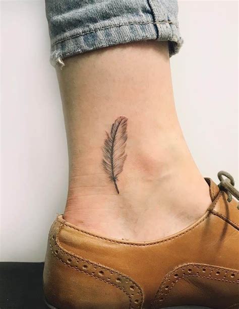 Small Feather Tattoo By Gabby Colledge Cool Wrist Tattoos Ankle Tattoo