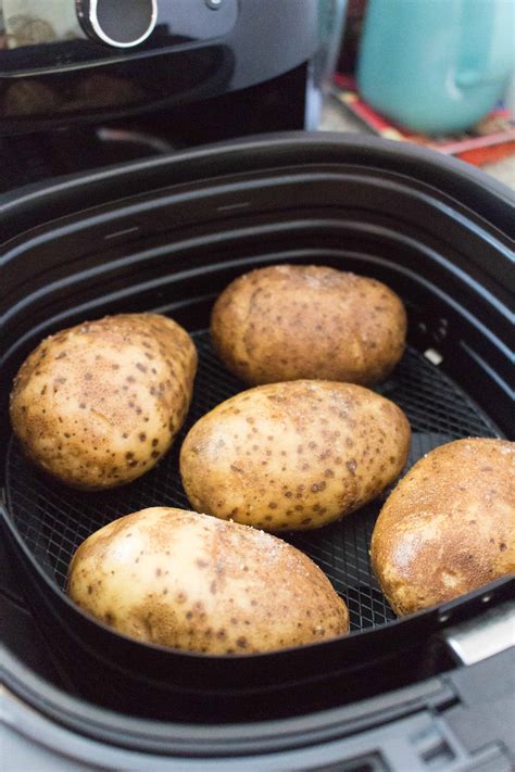 Place the potatoes in the basket of the air fryer. Airfryer Baked Potatoes - Carmy - Run Eat Travel