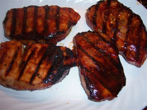 Barbecue pork chops are a basic grilling recipe that everyone standing over the coals should know how to master. BBQ Pork Chops - Putting It All On The Table
