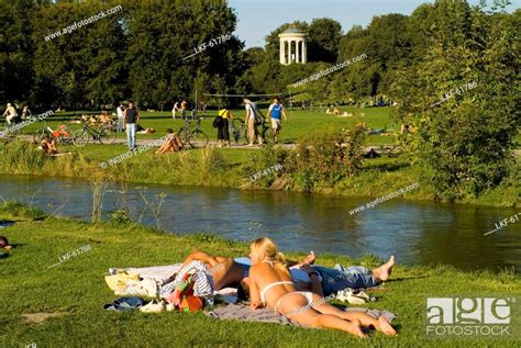 Sunbathing At Eisbach In Front Of Monopteros English Garden Munich Bavaria Germany Stock