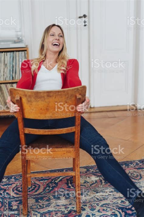 Young Woman Enjoying A Hearty Laugh At A Joke Stock Photo Download