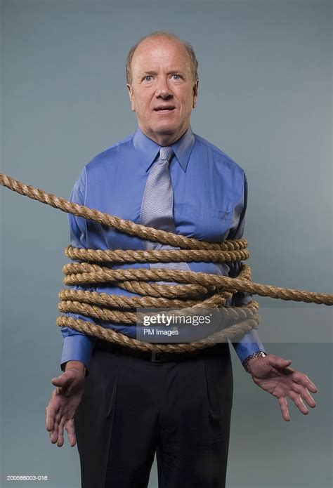 Mature Businessman Tied Up With Rope Portrait Photo Getty Images