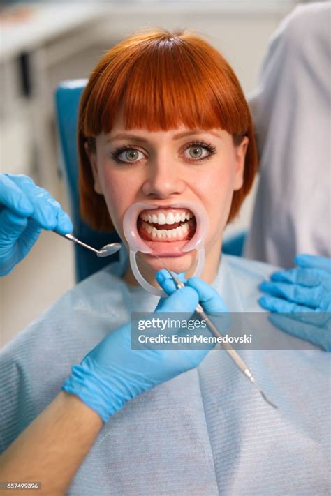Young Woman At Dentists Office For Routine Checkup High Res Stock Photo