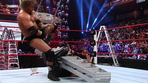Triple H Uses A Ladder To Help Him Apply The Figure Four On Kevin Nash
