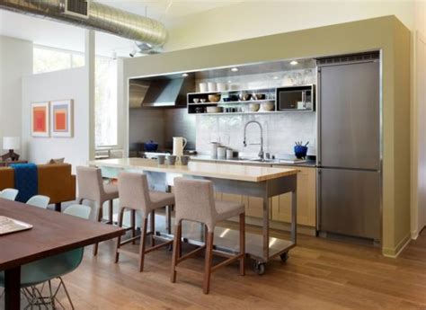 The wooden legs of the kitchen island is painted in white, with gray open shelves and a solid wood counter top. 10 Practical, versatile and multifunctional rolling ...