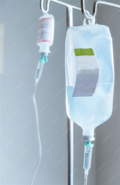 Premium Photo Close Up Of Iv Saline Solution Drip For Patient In Hospital