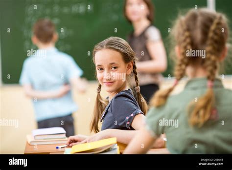 School Children In Classroom At Lesson Stock Photo Alamy
