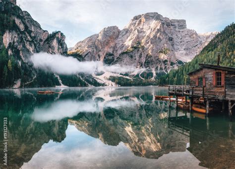 Panoramic View Of Braies Lake With The Hut And Boats In Dolomites