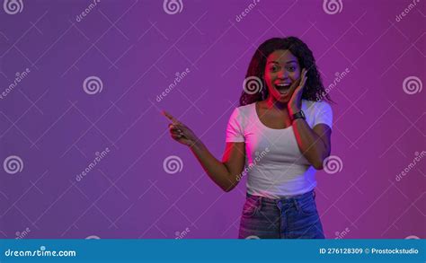 Look There Surprised Black Woman Pointing Aside At Copy Space In Neon