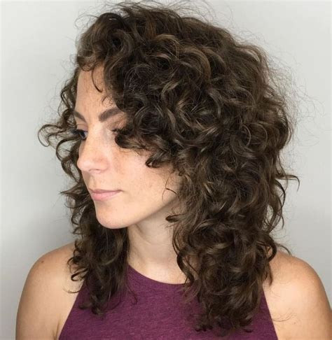 Medium length curly layered hairstyle