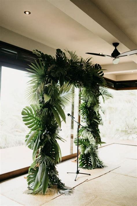 Ceremony Arch Decorated With A Variety Of Tropical Greenery Image By