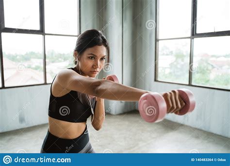 Woman Using Dumbbell Doing Some Boxing Exercise Stock Photo Image Of