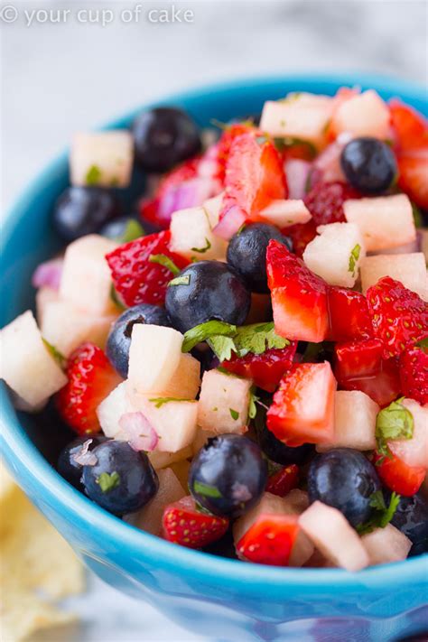 This sweet 4th of july fruit pizza from a food lovers kitchen combines fresh fruit and a tangy cream cheese frosting with a soft cookie crust. 4th of July Fruit Salsa - Your Cup of Cake