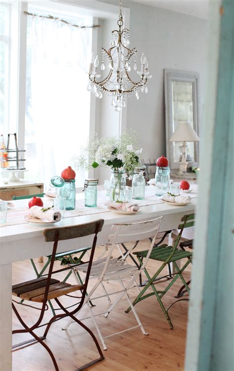 The white painted branches arranged in a spool of beige. Dreamy Whites: A Simple Christmas Table Setting