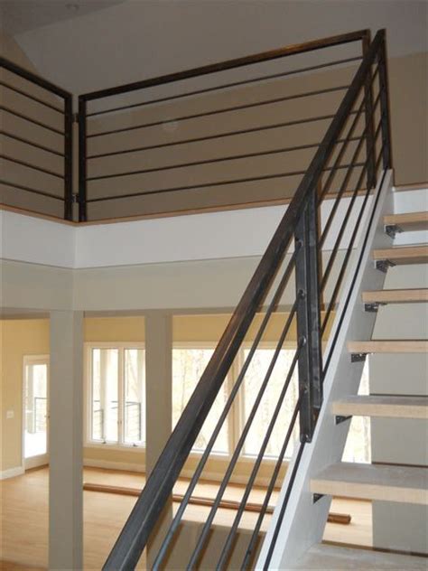 The choice of railing for your residential staircase affects everything from stair safety and maintenance to overall aesthetic appeal. Metal stair rail -something like this with a wooden ...