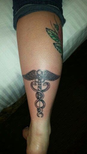 Caduceus Tattoo With Antique Syringe Its Weird Placement And Kinda Big