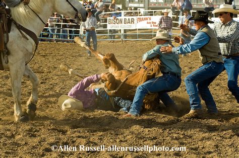 Rodeo Saddle Bronc Rider Is Rescued After Bronc Flips
