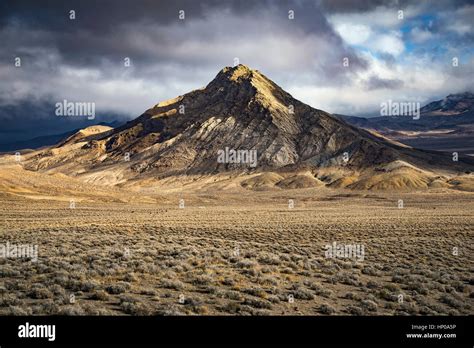 Mountain In The Nevada Desert With Dramatic Light And Clouds Chalk Mt