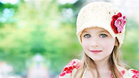 Cute Little Girl Is Wearing Yellow And Red Dress And Wool