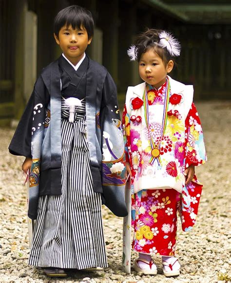 A Young Japanese Girl Wearing A Traditional Kimono While Celebrating