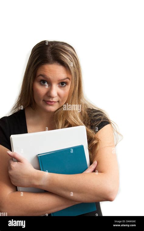 An Attractive Female College Student Holding Books Looking Into The