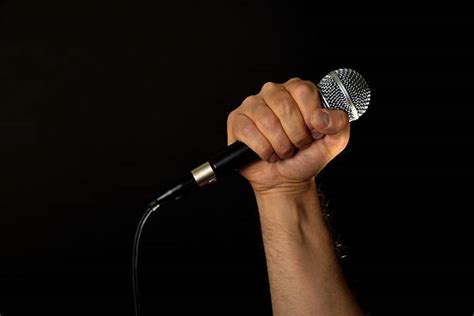Holding A Microphone Stock Photos Pictures And Royalty Free Images Istock