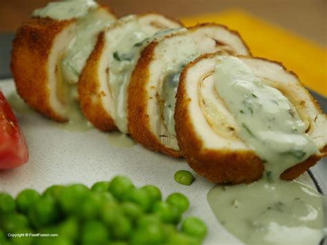 The ham and swiss cheese are arranged on top of the chicken breast and rolled together then dredged in bread crumbs. Chicken Cordon Blue - Food Fusion