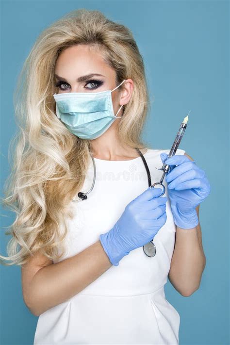 Blond Nurse In Glasses Holding A Stethoscope And A Syringe Stock Image Image Of Lashes