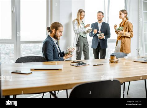 Group Of A Young Office Workers During A Lunch Time In The Office