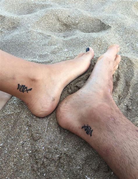 Name tattoos are believed to bring back luck to relationships. boyfriend girlfriend relationship tattoo beach holidays couple