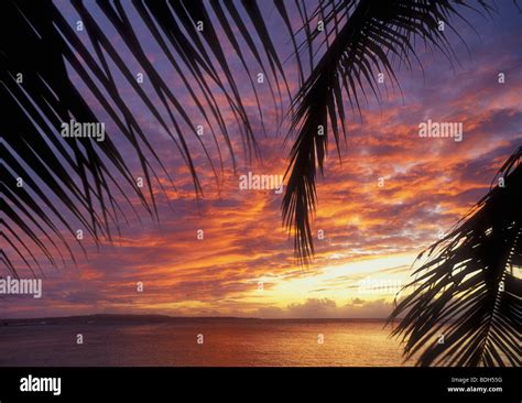 Sunset From The Pacific Islands Club Resort With Tinian Island In The