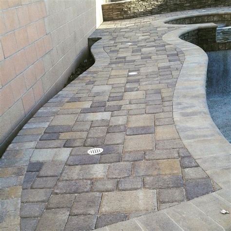 Belgard's smooth bullnose paver surrounds your pool or works as a unique step application, also complementing belgard pavers such as dublin and bergerac. Raised bondbeam/paver pool deck/Belgard/Cambridge cobble ...