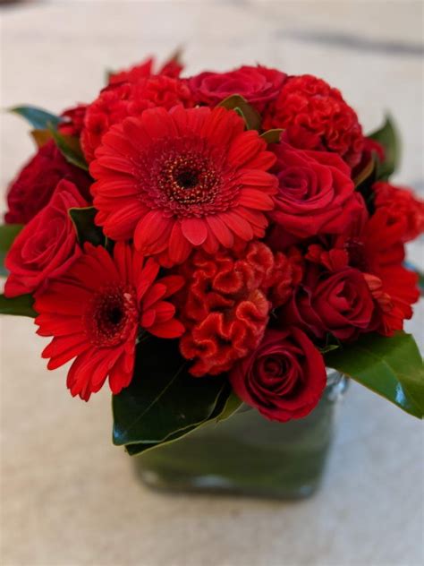 Red Flower Arrangement In A Vase Uniting Flowers Australia