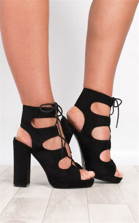 Featuring an open back with a strap, slingback heels are classics for your shoe. Oralia Block Lace-Up Heels in Black s | ikrush