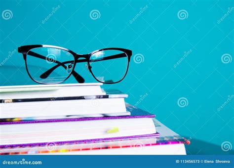 Glasses On A Stack Of Books In The Interior In A Minimalist Style