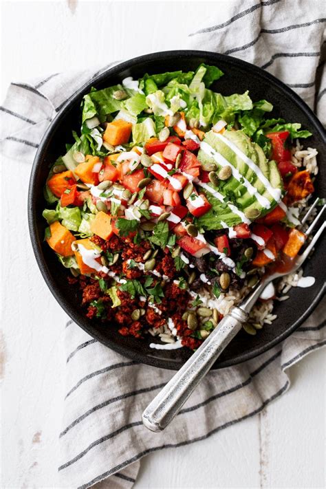We love roasted sweet potatoes, especially in grain bowls like this one! Brown Rice, Black Bean & Sweet Potato Bowl in 2020 | Brown ...