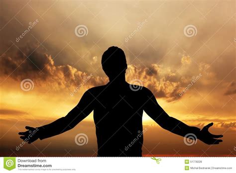 Man Praying Meditating In Harmony And Peace At Sunset Stock Photo