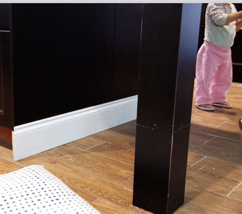 Check out the chrome metal pant hangers pkg/3 in the container store. Customizing Our Ikea Kitchen Island - Chris Loves Julia