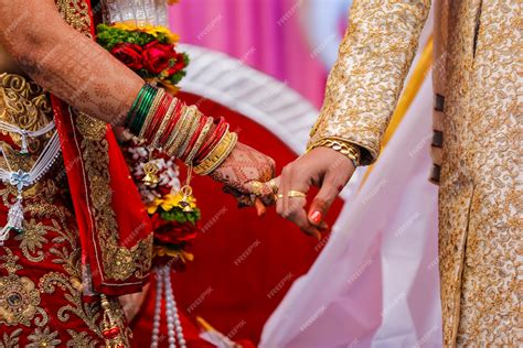 premium photo traditional indian wedding ceremony groom holding hand in bride hand