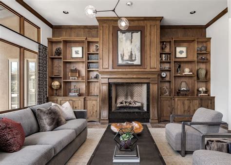 Our clients wanted to turn part of an expansive open dining room into a library. Grand Floor-to-Ceiling Fireplace With Built-In Bookshelves ...