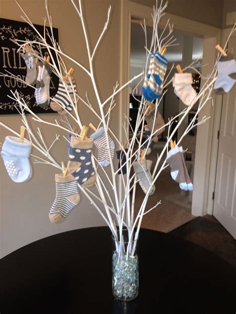 Baby shower theme ideas tend to change as more babies are added. Baby Shower Sock Tree | Winter baby shower in 2019 | Baby ...