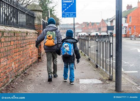 Travel Concept Of Two Boys With Backpacks Going Forward Stock Image