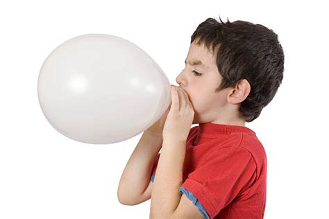 4400 Kid Blowing Up Balloon Stock Photos Pictures And Royalty Free