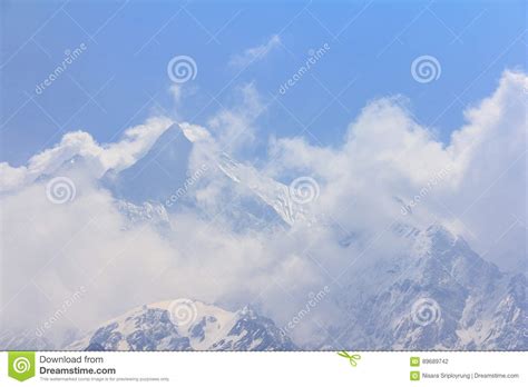 Himalaya Machapuchare Mountain Peak In Cloudy Blue Sky Nepal Stock