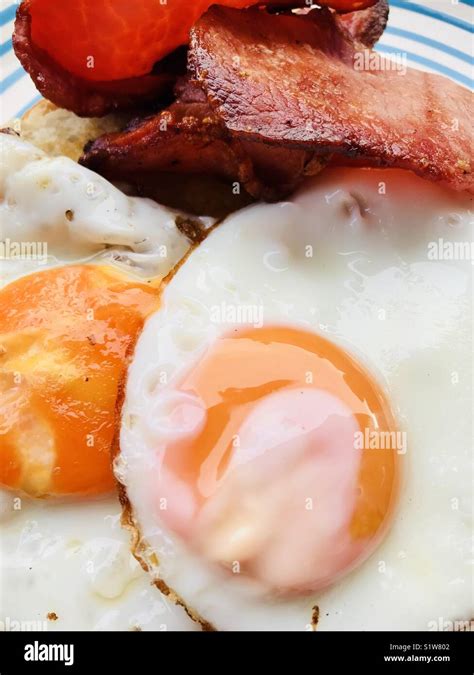 Breakfast Fried Eggs And Bacon On Toast Stock Photo Alamy