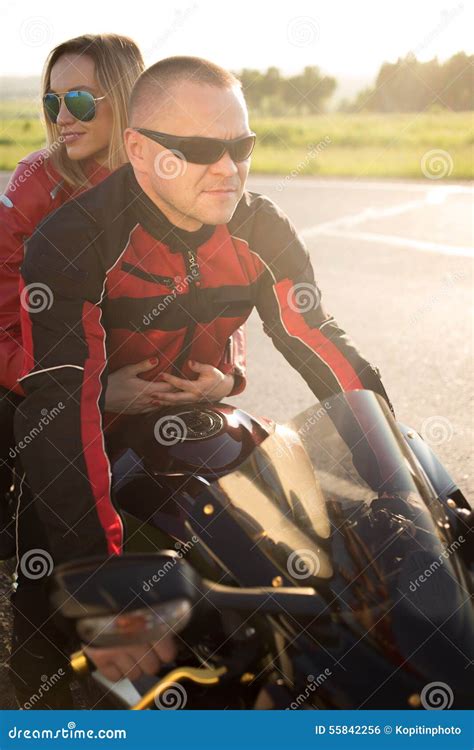 Biker Man And Woman Sitting On A Motorcycle Stock Photo Image Of