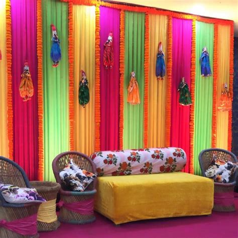 Colourful Drapes With Props For Mehandi Decorationindianweddingblog