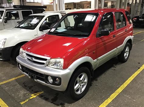 2004 DAIHATSU TERIOS DX 4x4 N A RED 5 SP MANUAL 4x4 4D WAGON City